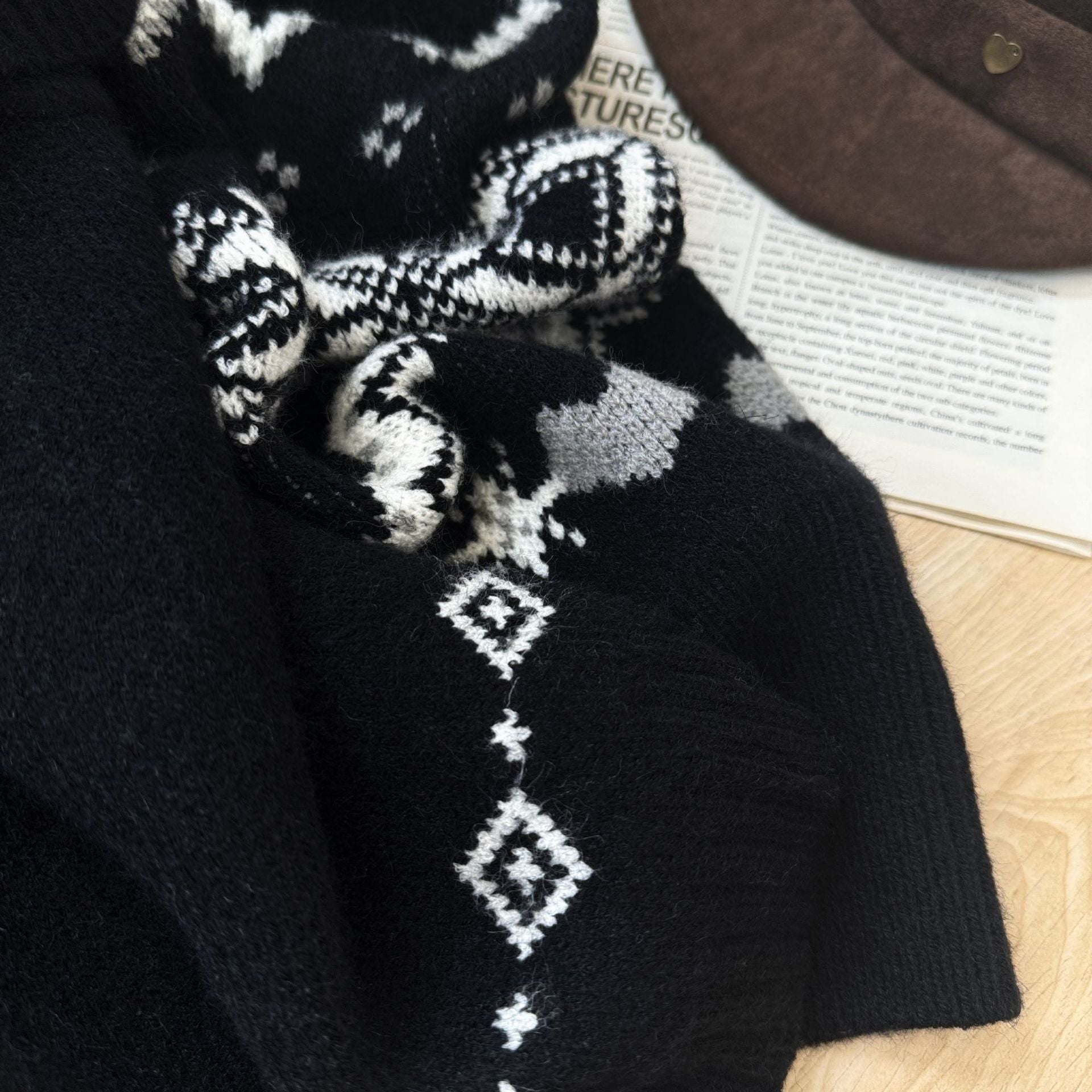 Close-up of the Nordic Echo Knit Set featuring intricate black and white patterns perfect for winter wear