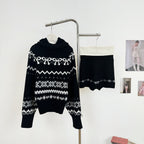 AM Vision RO Nordic Echo Knit Set featuring a cozy turtleneck sweater and matching skirt in black and white