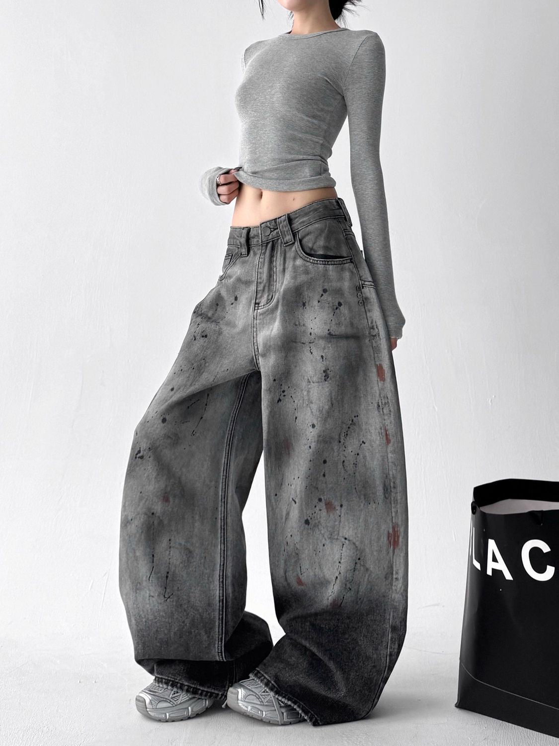 Ocean Curve Washed Street Jeans in a relaxed fit with stylish distressed detail and a model showcasing a casual outfit