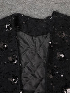 Stylish black Oversize Jacket with Applications featuring sequin detailing and quilted interior
