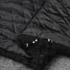 Close-up of AM Vision RO Oversize Jacket with Applications featuring quilted fabric and sequin detailing