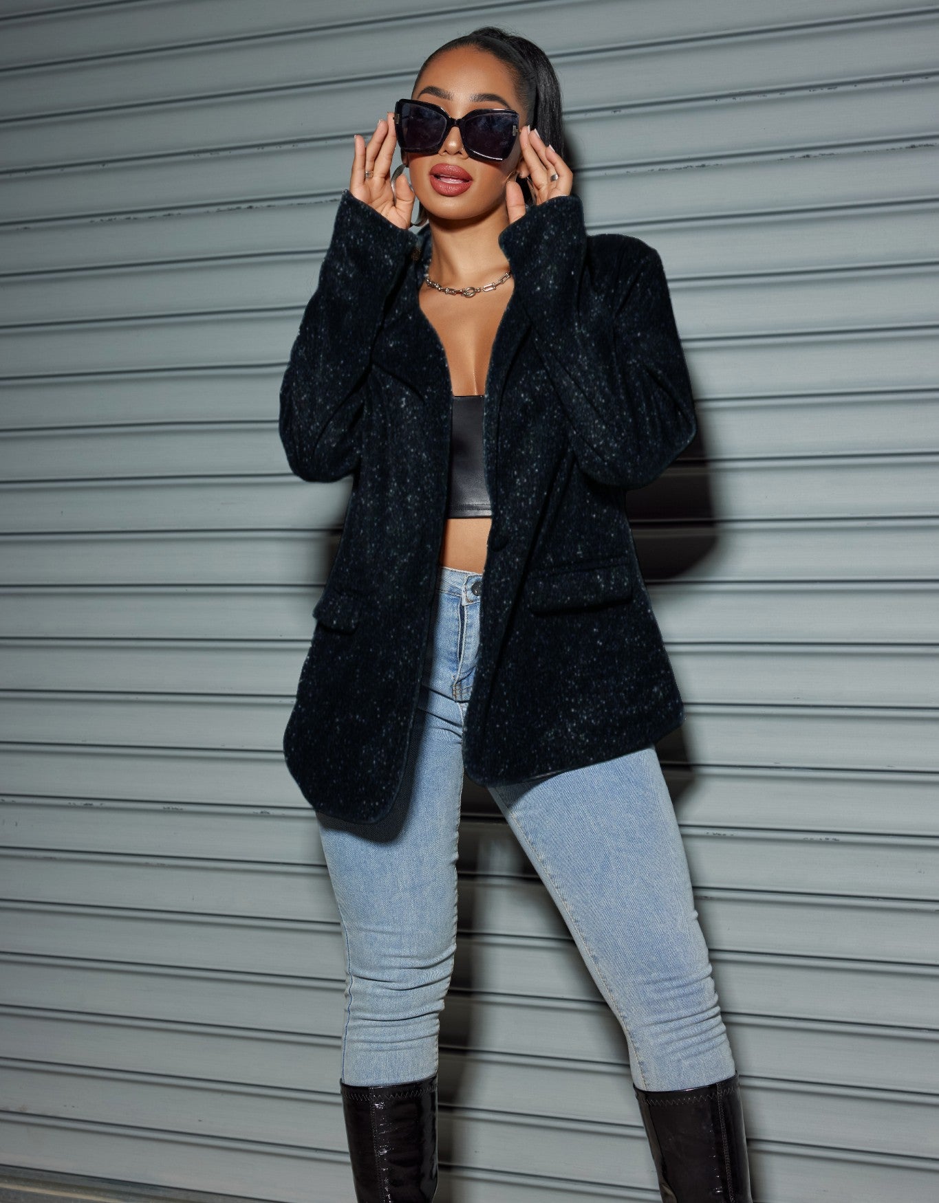Model wearing an Oversized Sequin Cardigan Blazer styled with a chic look and modern sunglasses