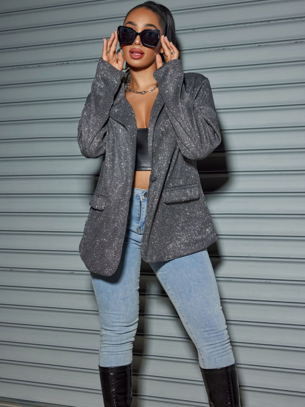 Stylish woman wearing an Oversized Sequin Cardigan Blazer with chic sunglasses and light jeans
