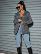 Stylish model wearing an Oversized Sequin Cardigan Blazer over a black top and jeans