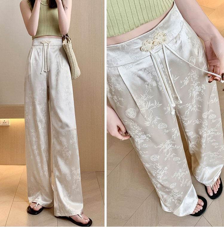Pantaloni largi din satin ivoire cu imprimeu floral și șnur decorativ la talie pentru femei