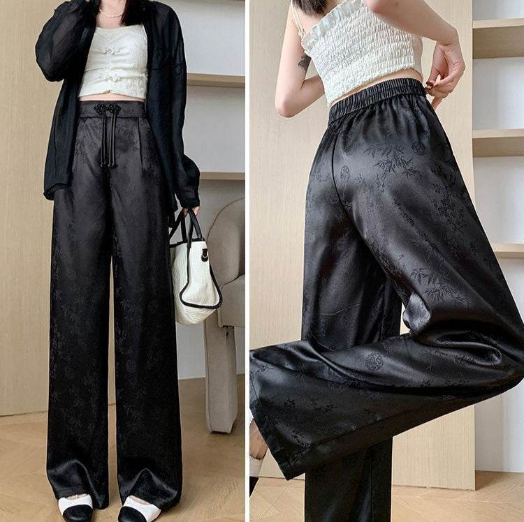 Pantaloni largi negri din satin cu model subtil floral și talie elastică de la AM Vision RO