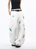 White Petal District Cargo Pants with Colorful Floral Embroideries and Relaxed Fit for Casual Style