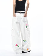 White Petal District Cargo Pants with Colorful Floral Embroidery and Spacious Pockets