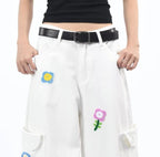 White Petal District Cargo Pants with Colorful Flower Embroidery and Black Belt for Stylish Comfort