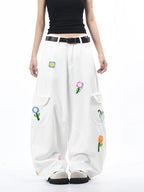 Stylish white Petal District Cargo Pants featuring colorful flower embroidery and spacious pockets