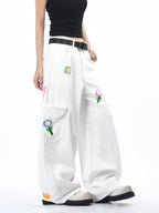 Stylish white Petal District Cargo Pants with colorful floral embroidery and relaxed fit