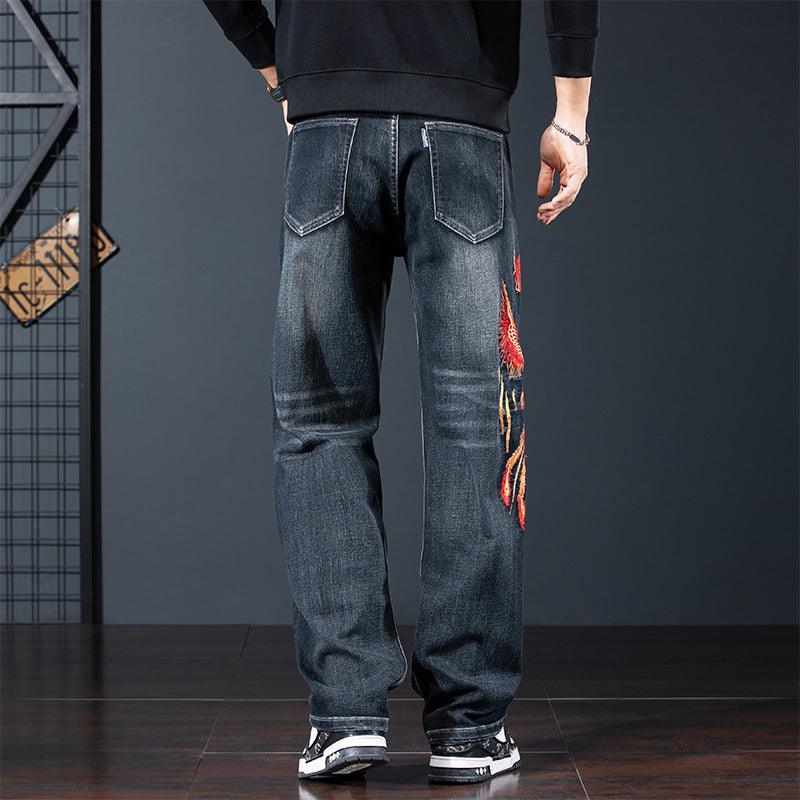 Back view of Phoenix Flight Embroidered Jeans featuring vibrant flame embroidery and a modern fit