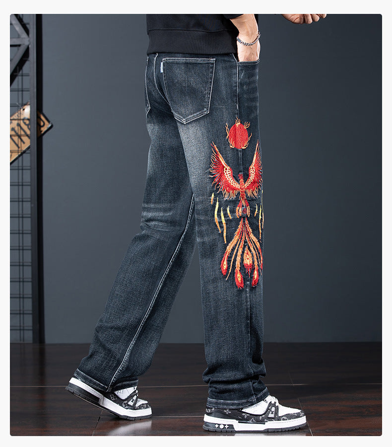 AM Vision RO Phoenix Flight Embroidered Jeans featuring a detailed phoenix design on the leg
