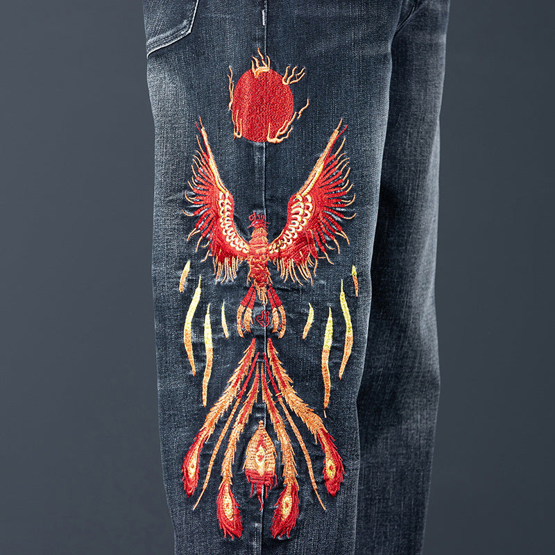 Phoenix Flight Embroidered Jeans featuring vibrant phoenix design on the leg for a unique style