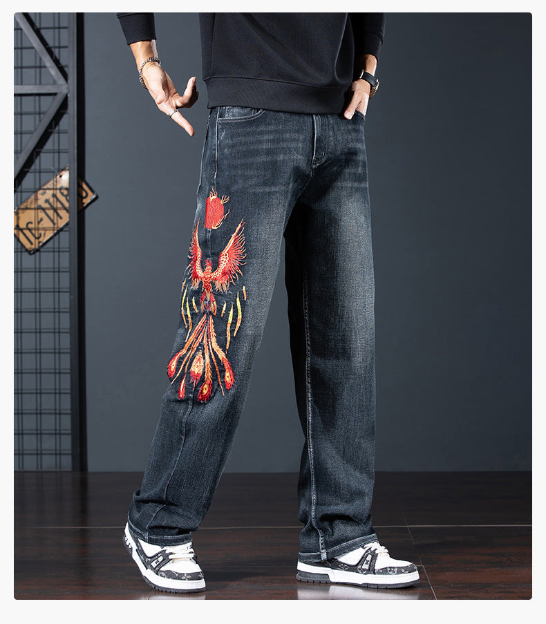 Phoenix Flight Embroidered Jeans in Dark Denim with Colorful Phoenix Design on Leg