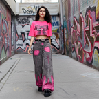 Stylish model wearing Pink Brushstroke Gray Straight Leg Jeans with graffiti background for urban fashion