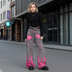 Fashionable model wearing Pink Brushstroke Gray Straight Leg Jeans paired with a black top and platform shoes