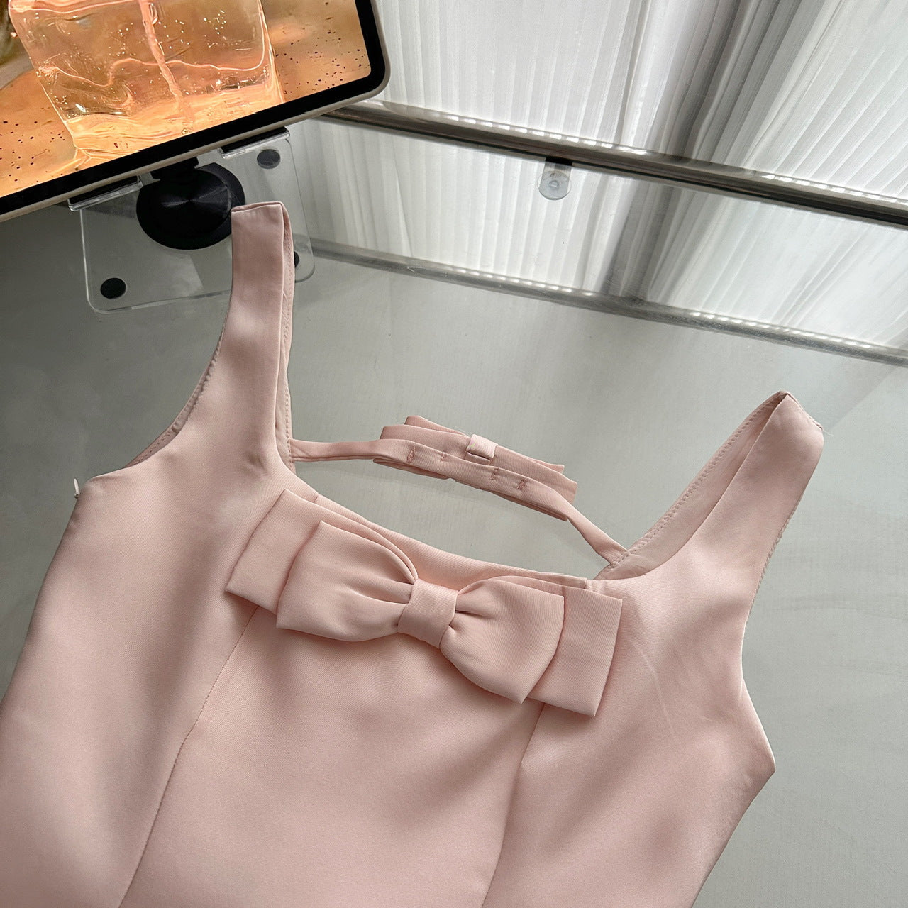 Close-up of the Pink Lotus Bow Princess Dress showcasing the bow detail on the front