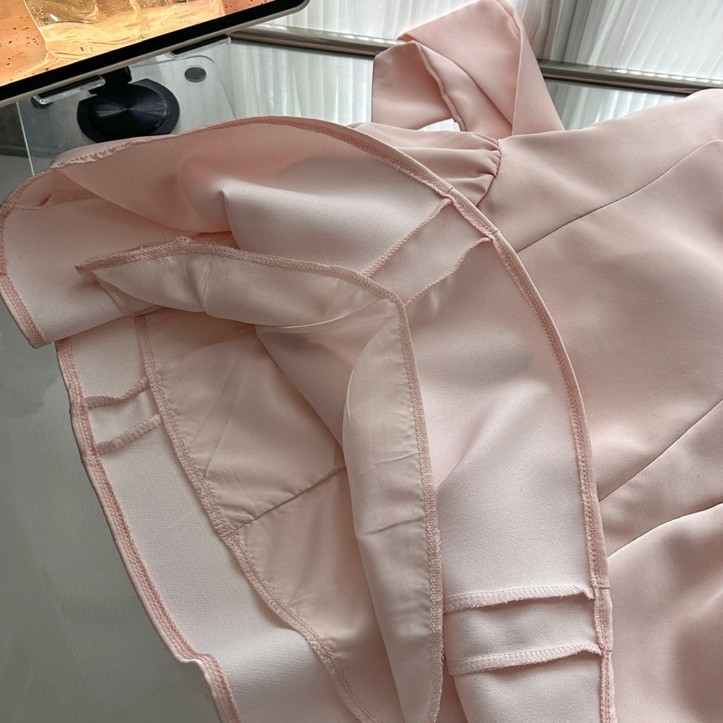 Close-up of the soft fabric of the Pink Lotus Bow Princess Dress with delicate ruffle details