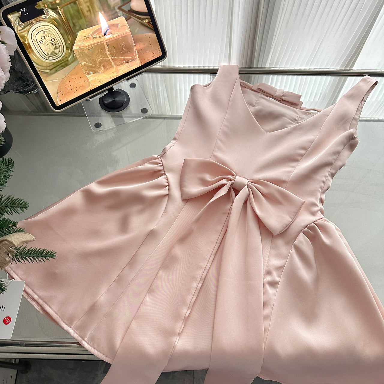 Pink Lotus Bow Princess Dress with a satin finish and elegant bow detail perfect for special occasions