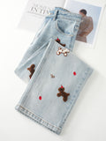Puppy Embroidered Retro Wide Leg Jeans in light blue with playful teddy bear designs and red accents