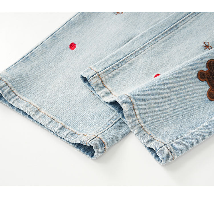 Detail of Puppy Embroidered Retro Wide Leg Jeans showcasing unique embroidery and denim texture
