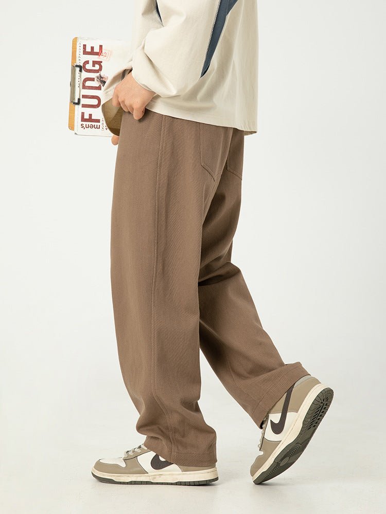 Model wearing Pure Cotton Retro Casual Pants in brown with a relaxed fit and side pockets