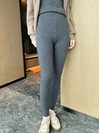 Model wearing Pure Warm Cashmere Knit Leggings in gray for stylish comfort and warmth