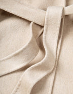 Close-up view of the fabric detail of the Red Double Sided Cashmere Maxi Coat showing the soft texture