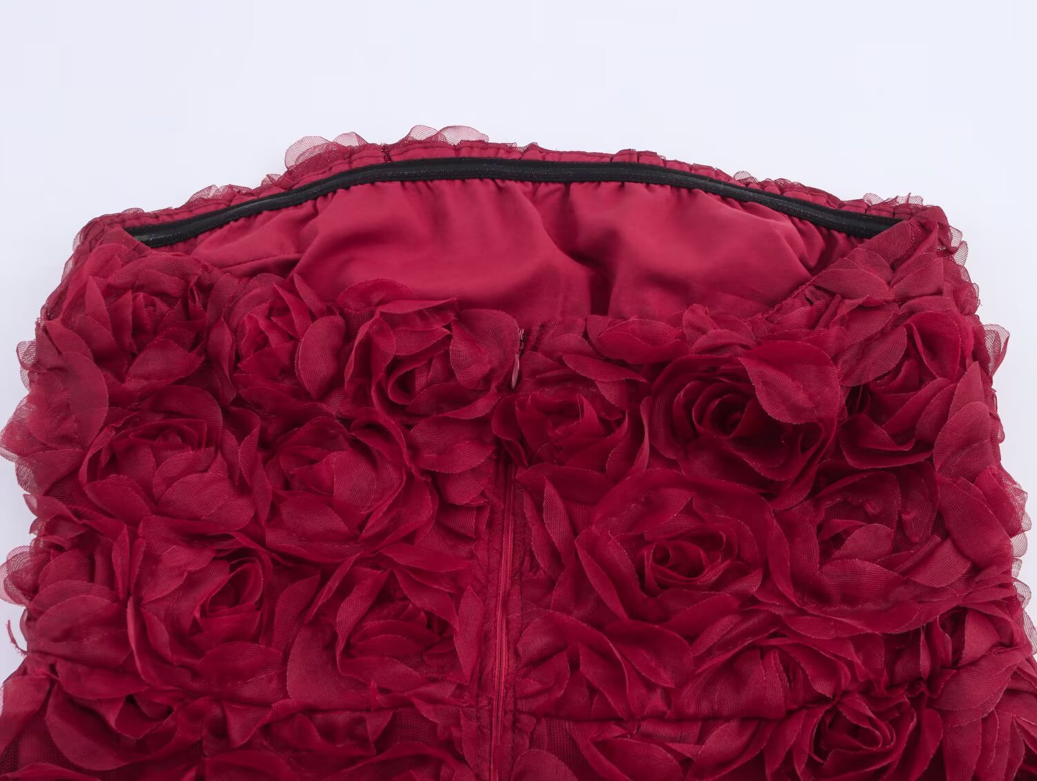 Close-up of the Red Rose Blossom Dress featuring 3D floral embellishments for a romantic look