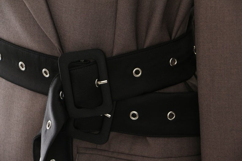 Close-up of a Retro Blazer with Belt featuring a stylish buckle and eyelet details