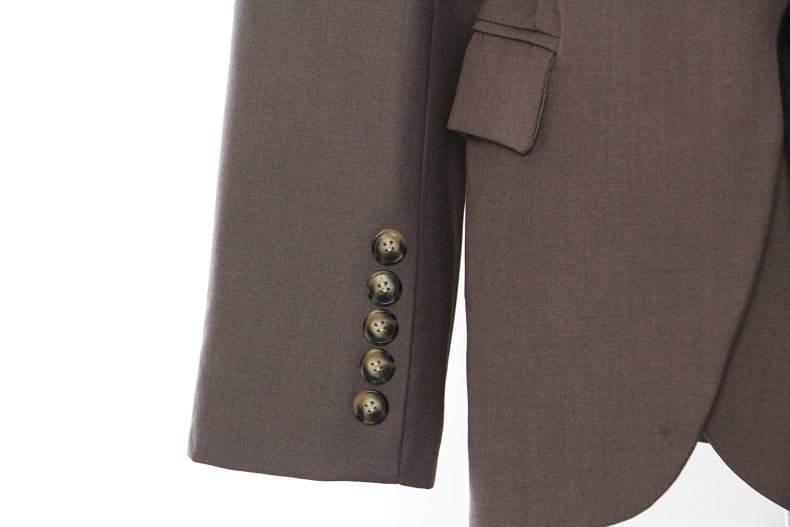 Close-up of a Retro Blazer with Belt showcasing elegant buttons and tailored sleeve details
