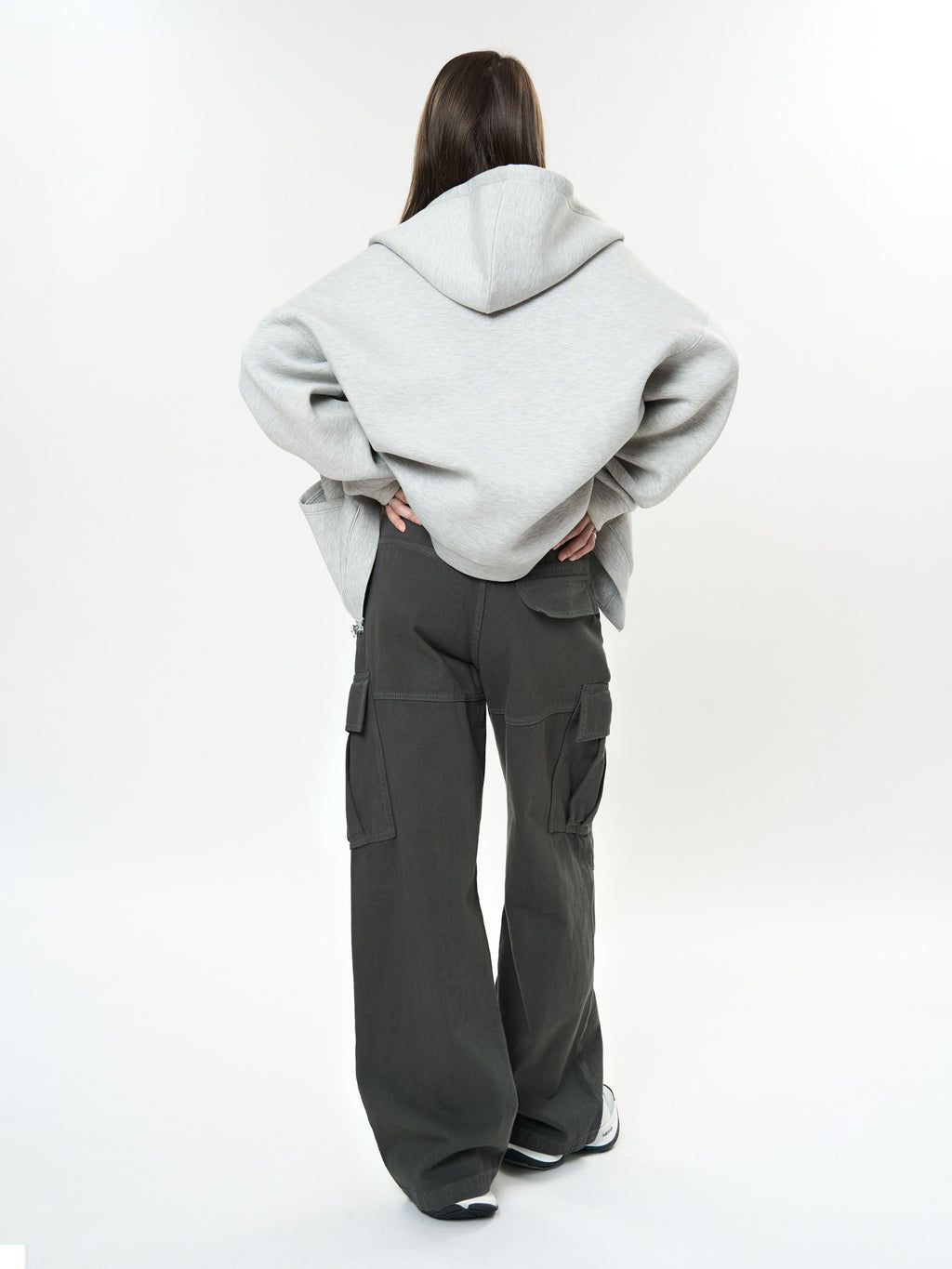 Woman wearing Retro Cargo Pocket Wide Leg Denim Pants styled with an oversized sweatshirt from the back