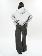 Woman wearing Retro Cargo Pocket Wide Leg Denim Pants styled with an oversized sweatshirt from the back