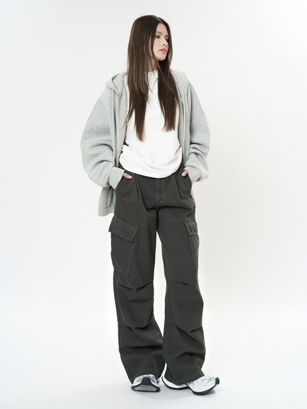 Women wearing Retro Cargo Pocket Wide Leg Denim Pants styled with a gray hoodie and sneakers