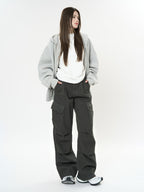 Women wearing Retro Cargo Pocket Wide Leg Denim Pants styled with a gray hoodie and sneakers