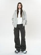 Model wearing Retro Cargo Pocket Wide Leg Denim Pants with a casual gray hoodie for a trendy look
