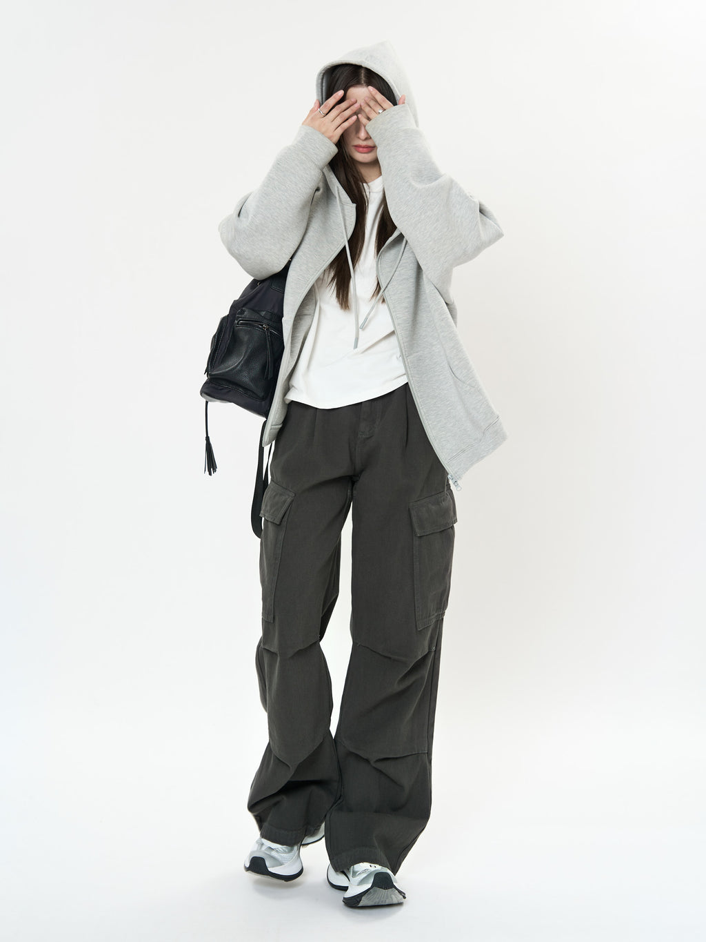 Model wearing Retro Cargo Pocket Wide Leg Denim Pants paired with a cozy hoodie and sneakers