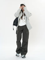 Model wearing Retro Cargo Pocket Wide Leg Denim Pants paired with a cozy hoodie and sneakers