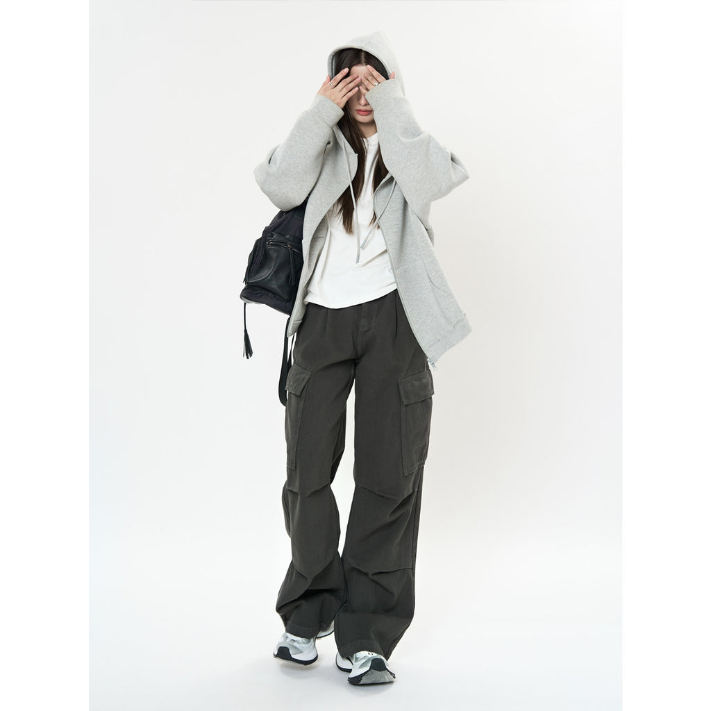 Model wearing Retro Cargo Pocket Wide Leg Denim Pants with a casual hooded sweatshirt and sneakers