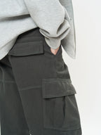 Close-up of Retro Cargo Pocket Wide Leg Denim Pants styled with a gray sweatshirt