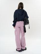 Woman wearing Retro Cargo Pocket Wide Leg Denim Pants in light pink with a black hoodie and bag