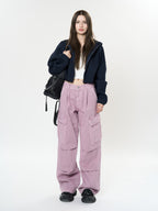 Model wearing Retro Cargo Pocket Wide Leg Denim Pants in pink with a matching cropped jacket