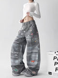 Model wearing Retro Washed Distressed 3D Print Chain Jeans with unique graphic designs and a relaxed fit