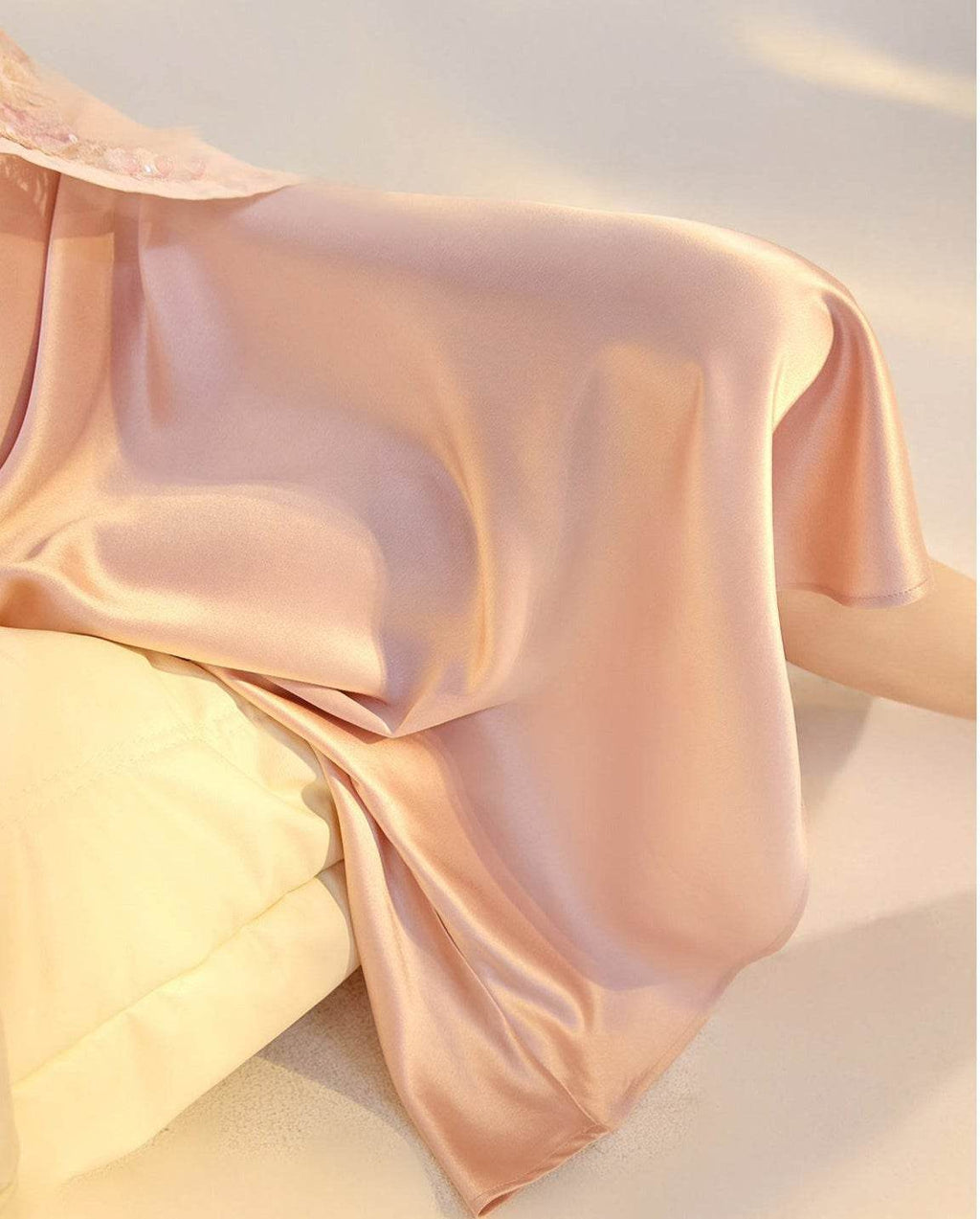 Soft Pink Satin Slip Dress with a Flowing Design for Elegant Evening Wear