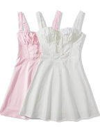 Set of two short dresses with corset design in pink and white for summer outings