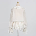 Back view of Short Lace Dress With Puff Sleeves featuring layered skirt and elegant design