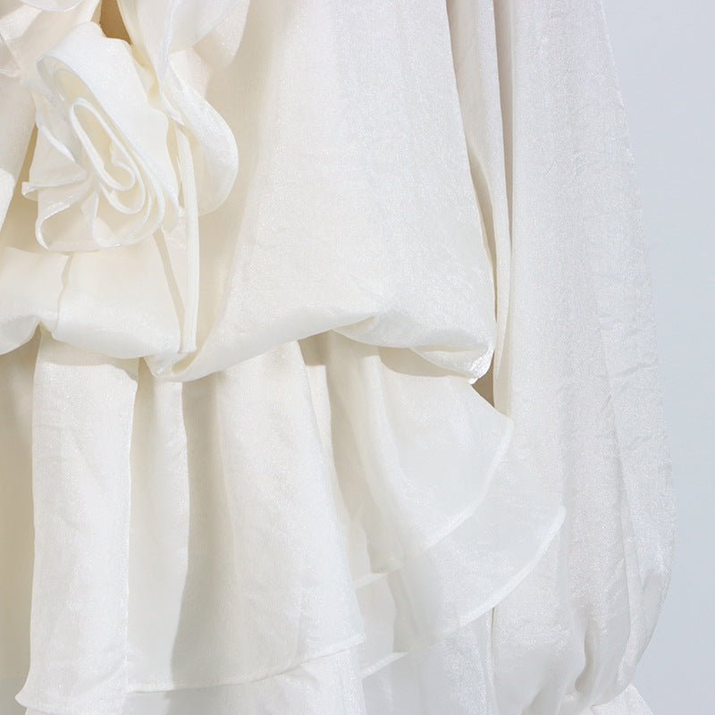 Elegant short lace dress with puff sleeves featuring a delicate floral design