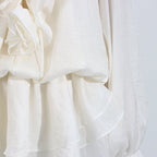Elegant short lace dress with puff sleeves featuring a delicate floral design