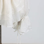Elegant Short Lace Dress With Puff Sleeves in white featuring layered design and drawstring details